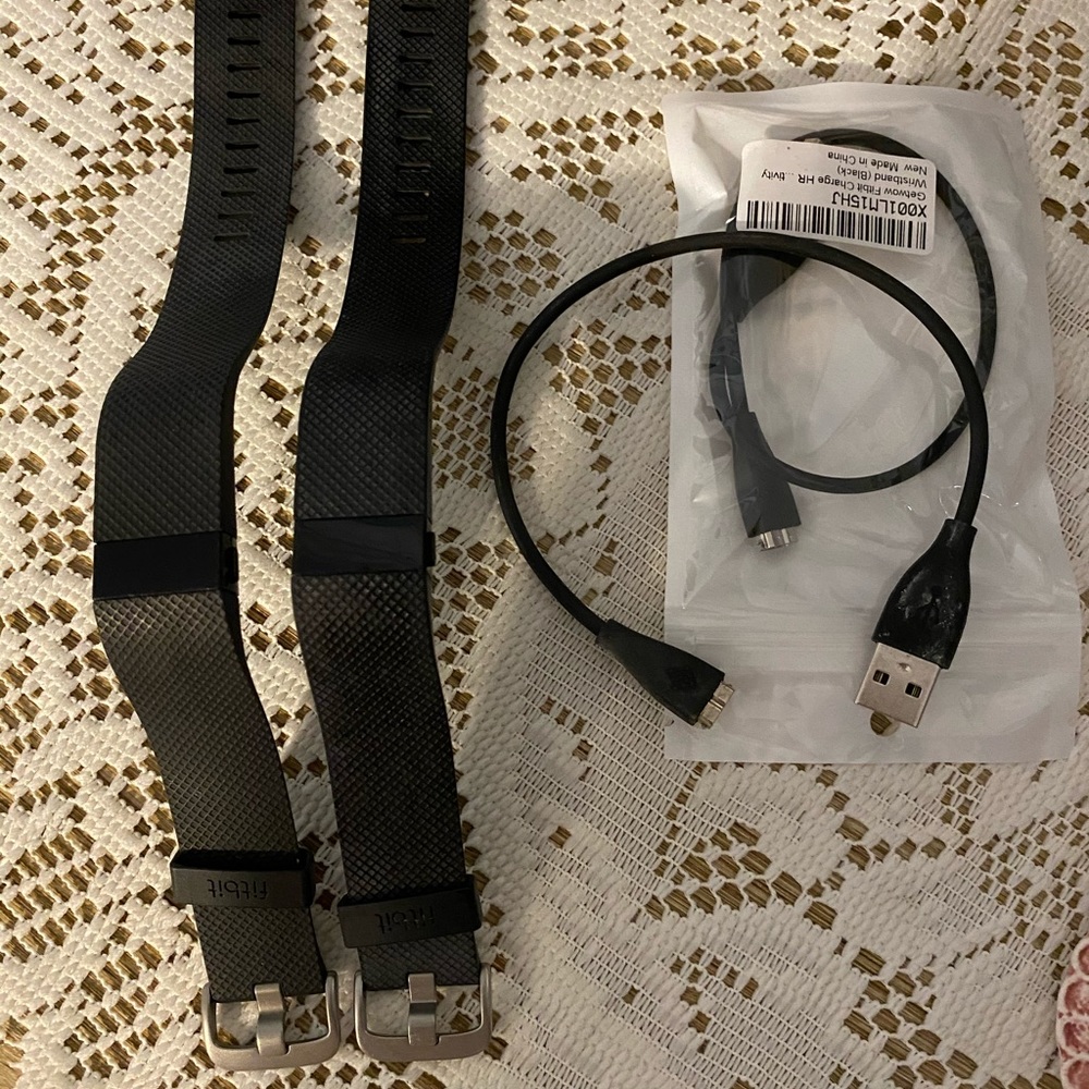 Two matching Fit Bit watches
